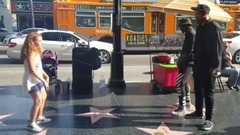 9year old girl stops and dances w street performer
